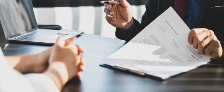 Lawyer in a suit advising on a trust signing